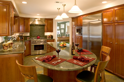Kitchen Cabinets in Cherry with Raised Panels and Full Overlay