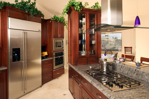 Kitchen Cabinets with Cherry Finish Raised Panels and Fluted Styles
